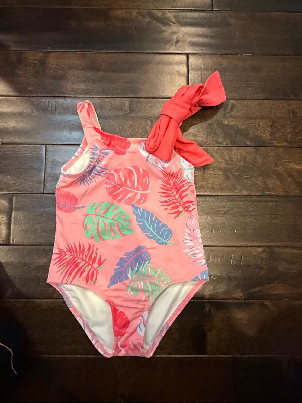 The Beaufort Bonnet Company Pink Tropical Leaf One-Shoulder Kids Swimsuit